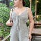 Jumpsuit Kayleigh Hai Dây Nền Trắng Vân Hoa Nhí Thắt Nơ Ngực